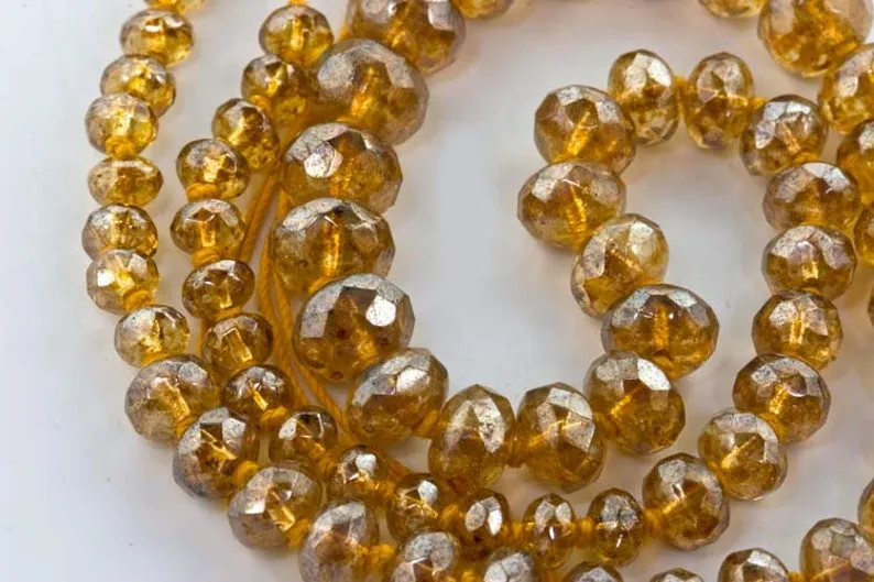 Graduated knotted strand gemstone-cut citrine luster glass bead strand.16 in. strand.  b11-yo-0878